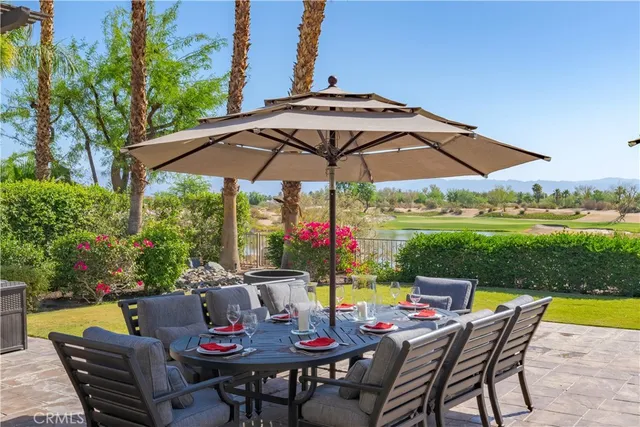 a view of an outdoor sitting area with furniture and backyard