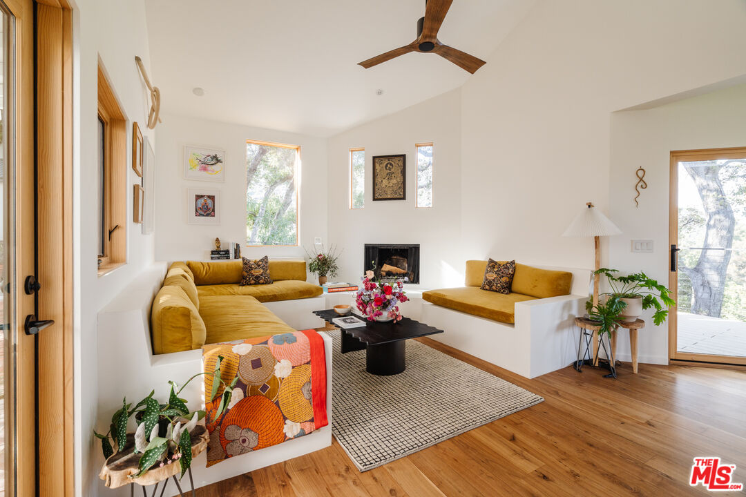 2002 Tuna Canyon Road Topanga, CA 90290 - Photo 18 of 70 a living room with furniture and wooden floor