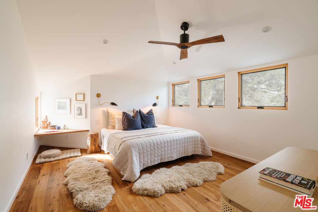 2002 Tuna Canyon Road Topanga, CA 90290 - Photo 26 of 70 a bedroom with a bed and a night stand