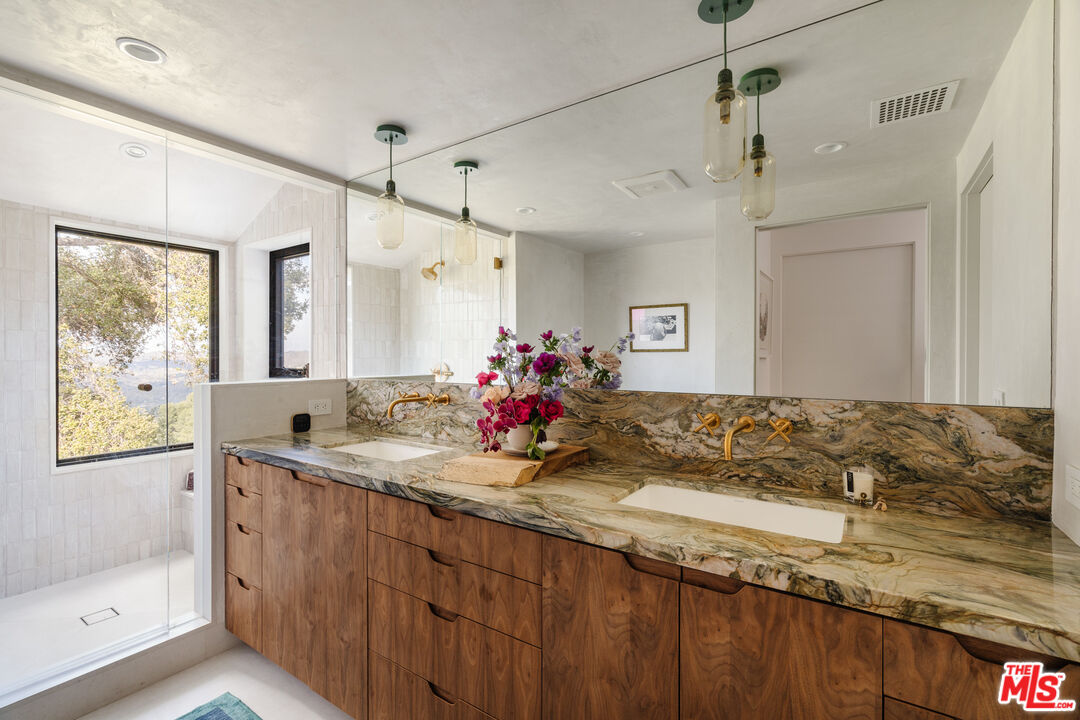 2002 Tuna Canyon Road Topanga, CA 90290 - Photo 27 of 70 a bathroom with a granite countertop sink mirror and double