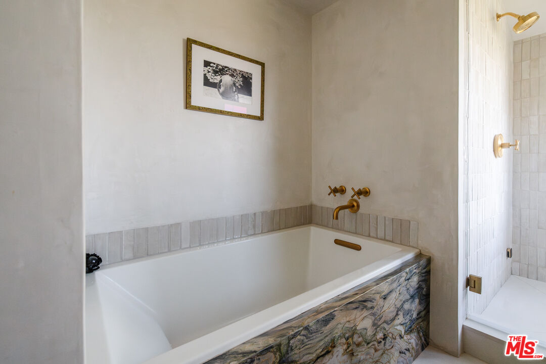 2002 Tuna Canyon Road Topanga, CA 90290 - Photo 28 of 70 a bath tub sitting next to a white sink