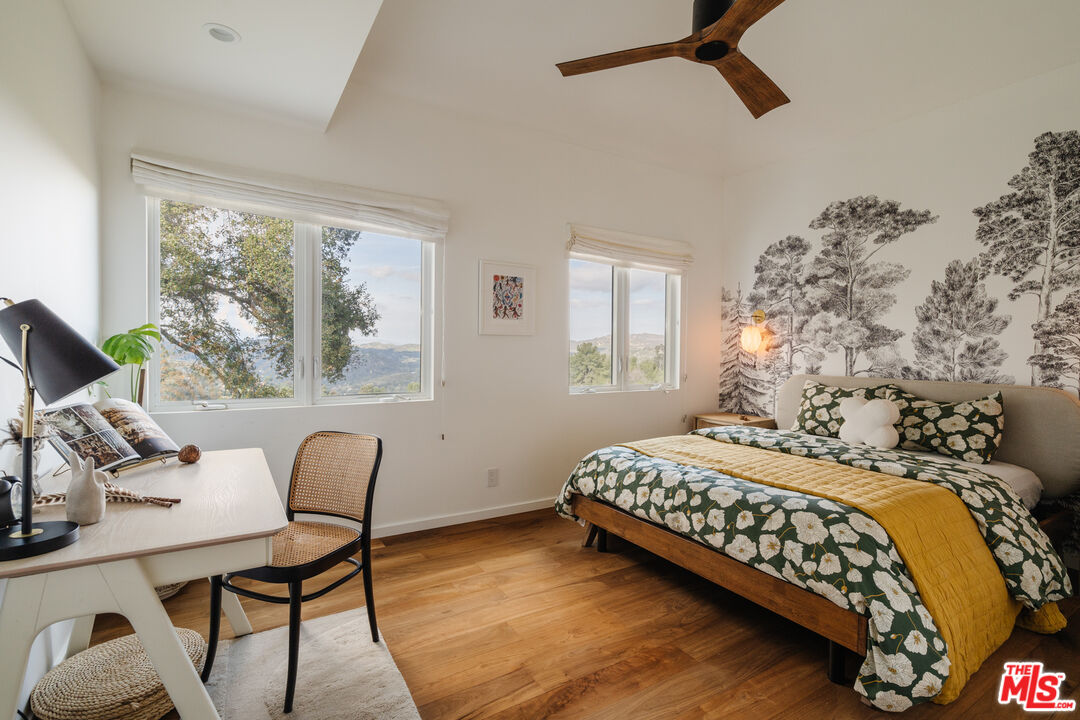 2002 Tuna Canyon Road Topanga, CA 90290 - Photo 38 of 70 a bedroom with a bed window and a desk