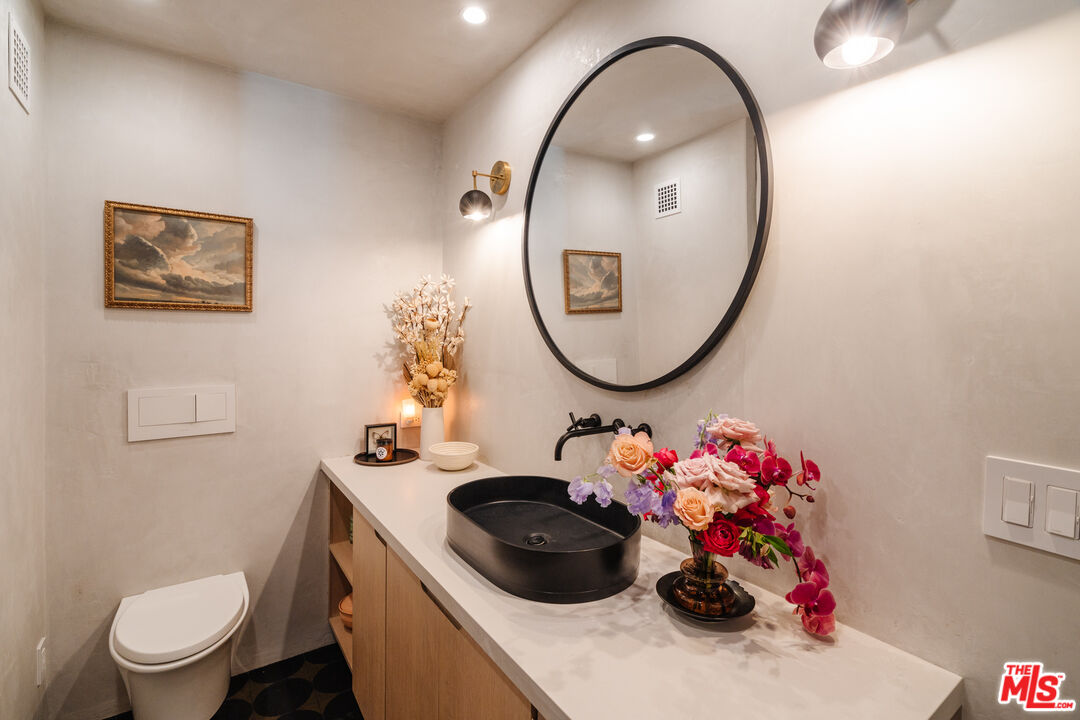 2002 Tuna Canyon Road Topanga, CA 90290 - Photo 43 of 70 a bathroom with a sink mirror and toilet