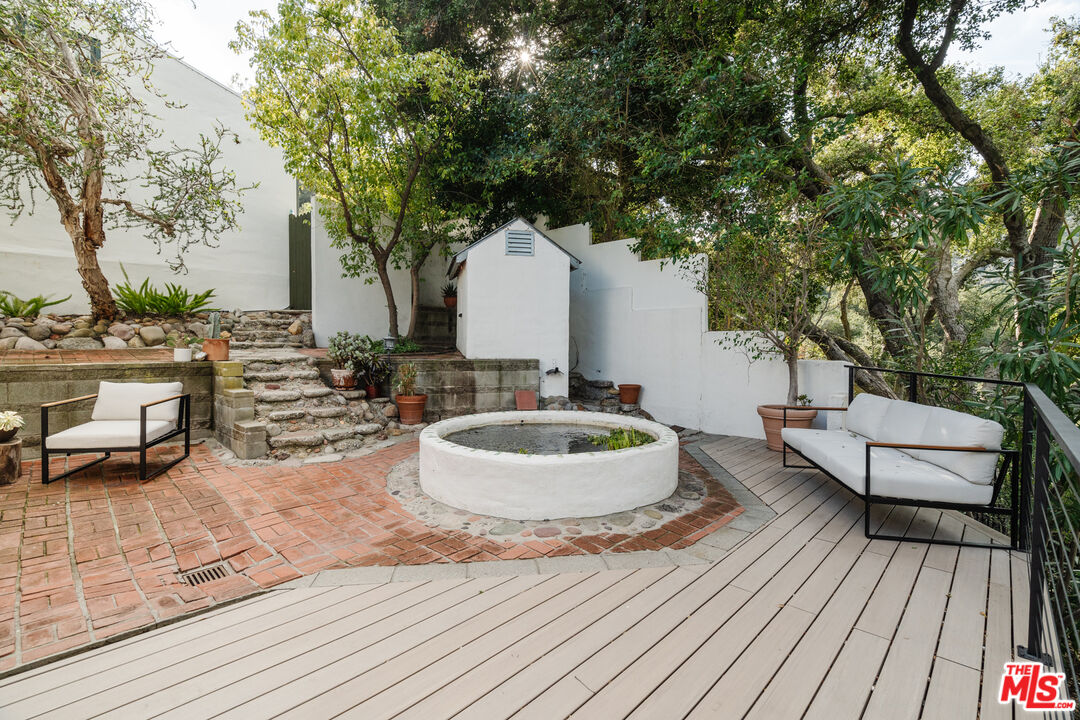 2002 Tuna Canyon Road Topanga, CA 90290 - Photo 51 of 70 a backyard of a house with table and chairs