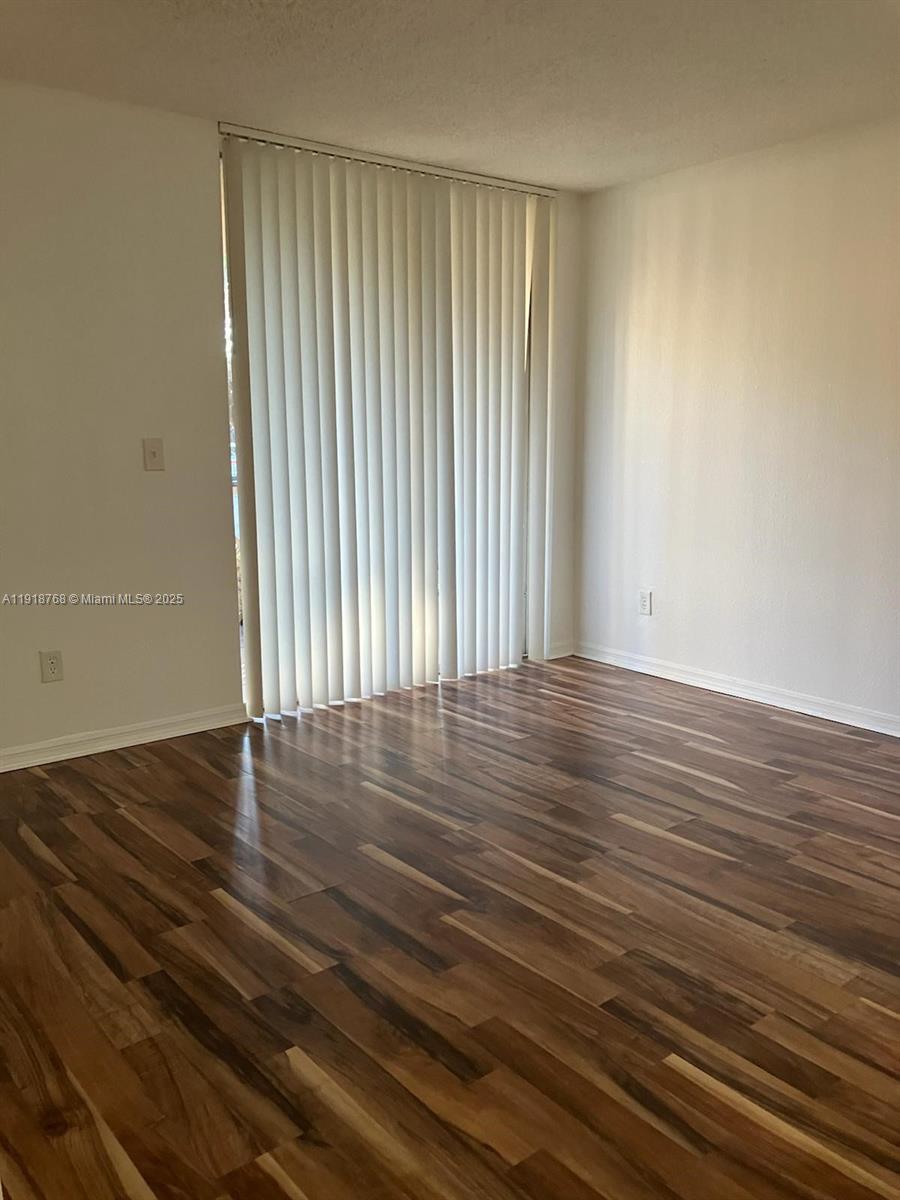4025 West McNab Road, Unit E105 Pompano Beach, FL 33069 - Photo 3 of 9 wooden floor in a room