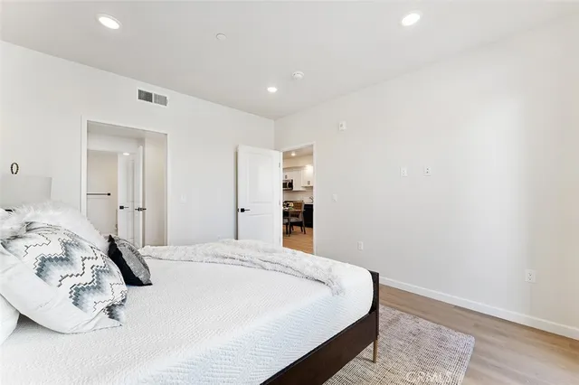 a large white bed in a white room