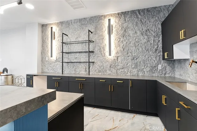 a kitchen with a sink stove and microwave