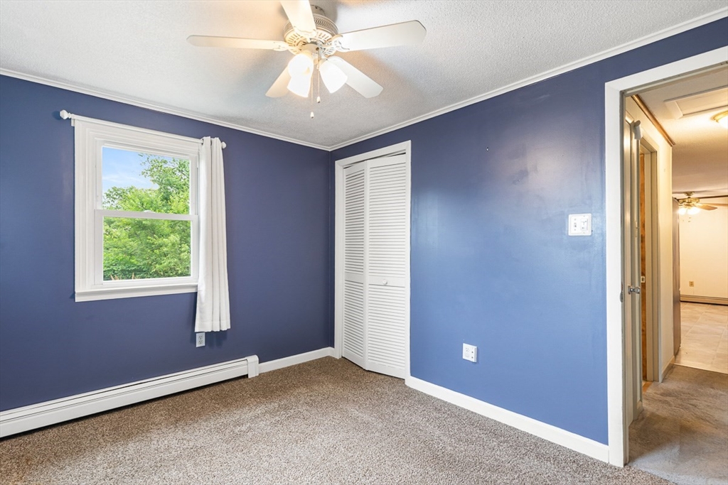 99 Swansom Road Swansea, MA 02777 - Photo 24 of 42 an empty room with windows and fan