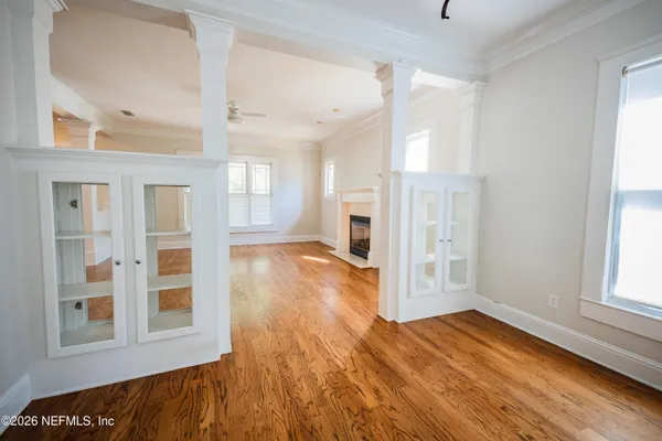 a kitchen with stainless steel appliances a sink cabinets and wooden floor
