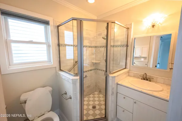 a view of entryway with wooden floor and stairs