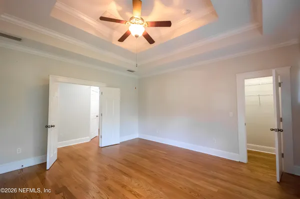 a bathroom with a double vanity sink mirror and toilet