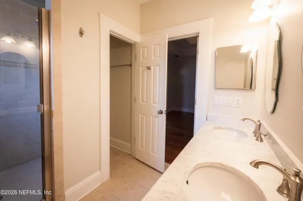 a bathroom with a window and a shower