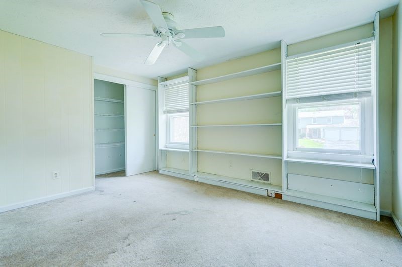 44 Latchmere Drive Victor, NY 14564 - Photo 32 of 50 LARGE BEDROOM #3 WITH BOOKSHELVES AND CEILING FAN.
