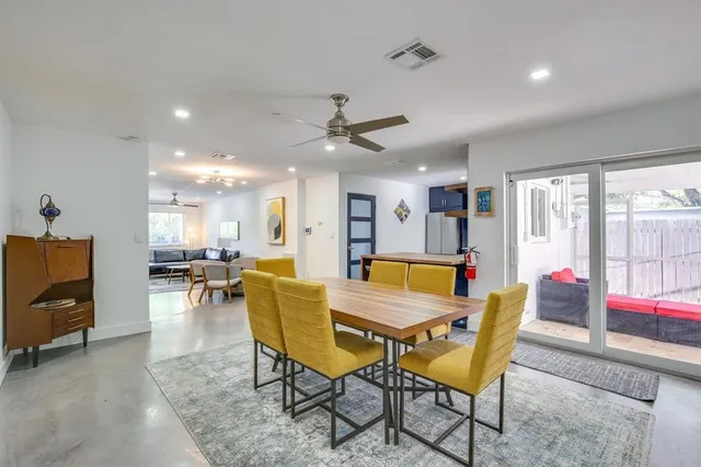 a view of a dining room with furniture and a livingroom