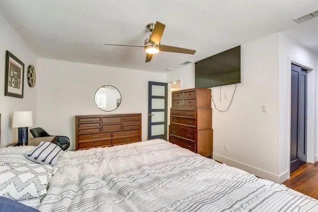 a bedroom with a bed and cabinets