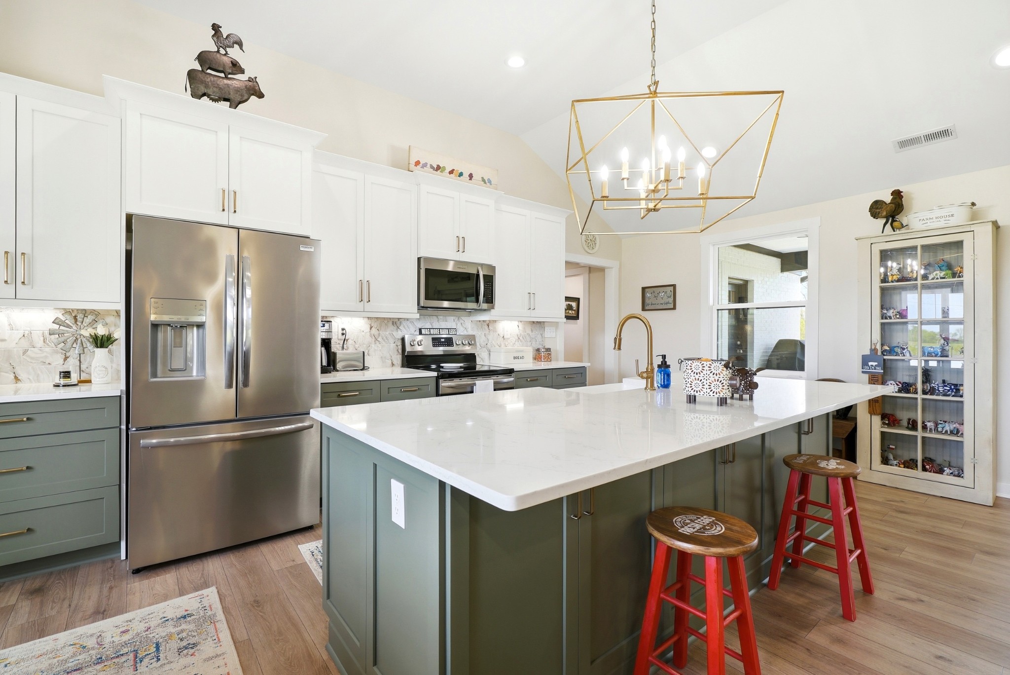 600 Squire Hall Road Shelbyville, TN 37160 - Photo 23 of 69 a kitchen with stainless steel appliances a table chairs refrigerator and microwave