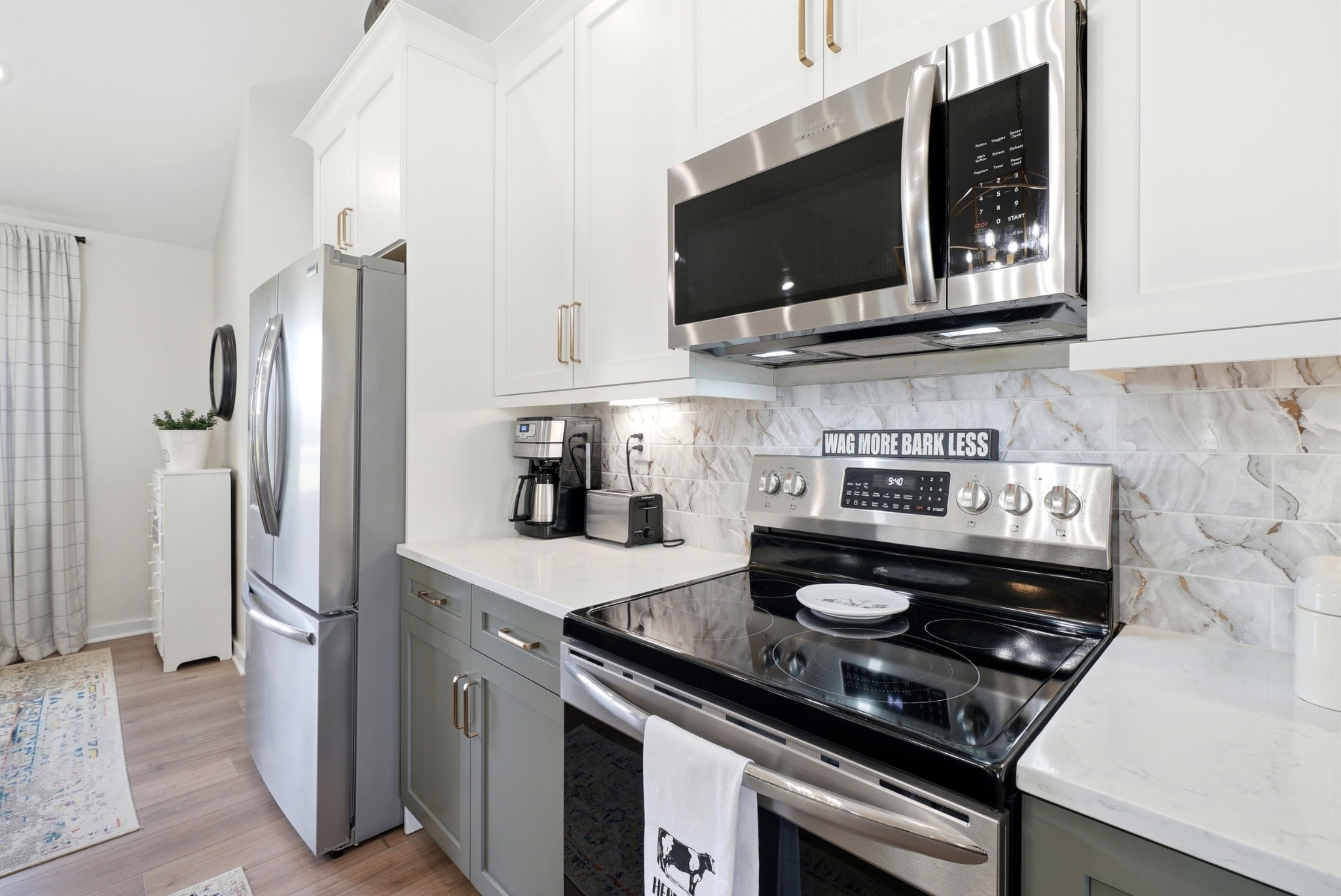 600 Squire Hall Road Shelbyville, TN 37160 - Photo 24 of 69 a kitchen with stainless steel appliances granite countertop a stove microwave and refrigerator