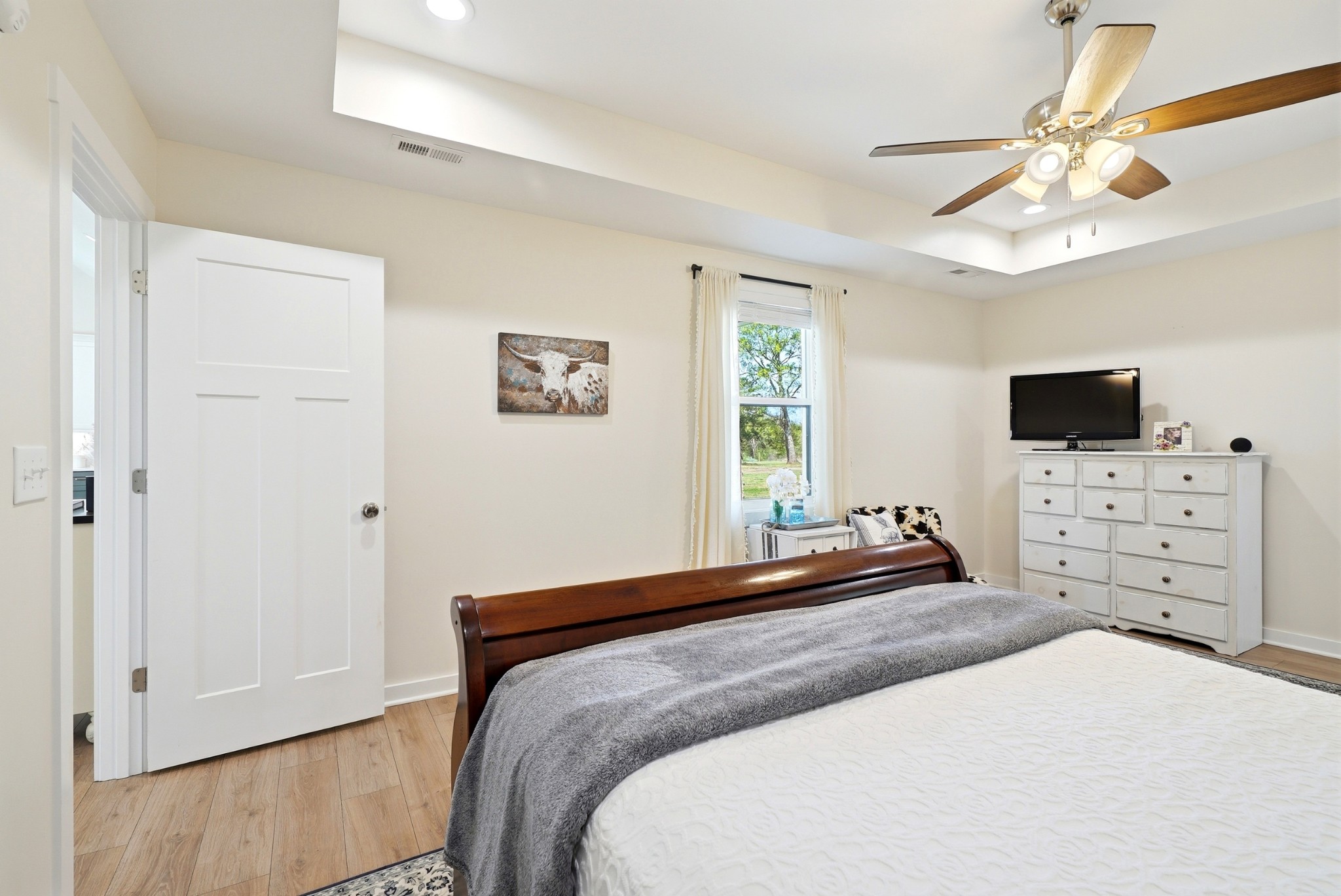 600 Squire Hall Road Shelbyville, TN 37160 - Photo 32 of 69 a bedroom with a bed and a flat screen tv