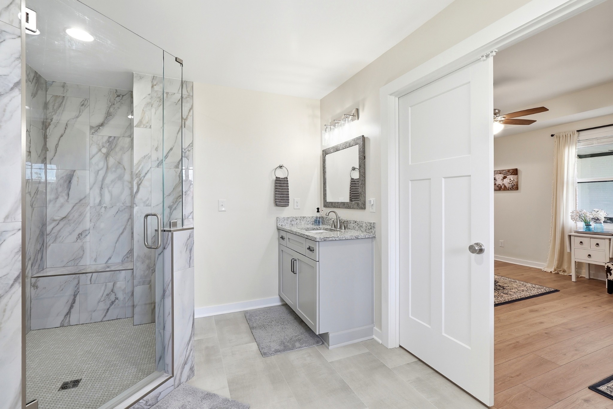 600 Squire Hall Road Shelbyville, TN 37160 - Photo 35 of 69 a bathroom with a granite countertop shower mirror and a sink