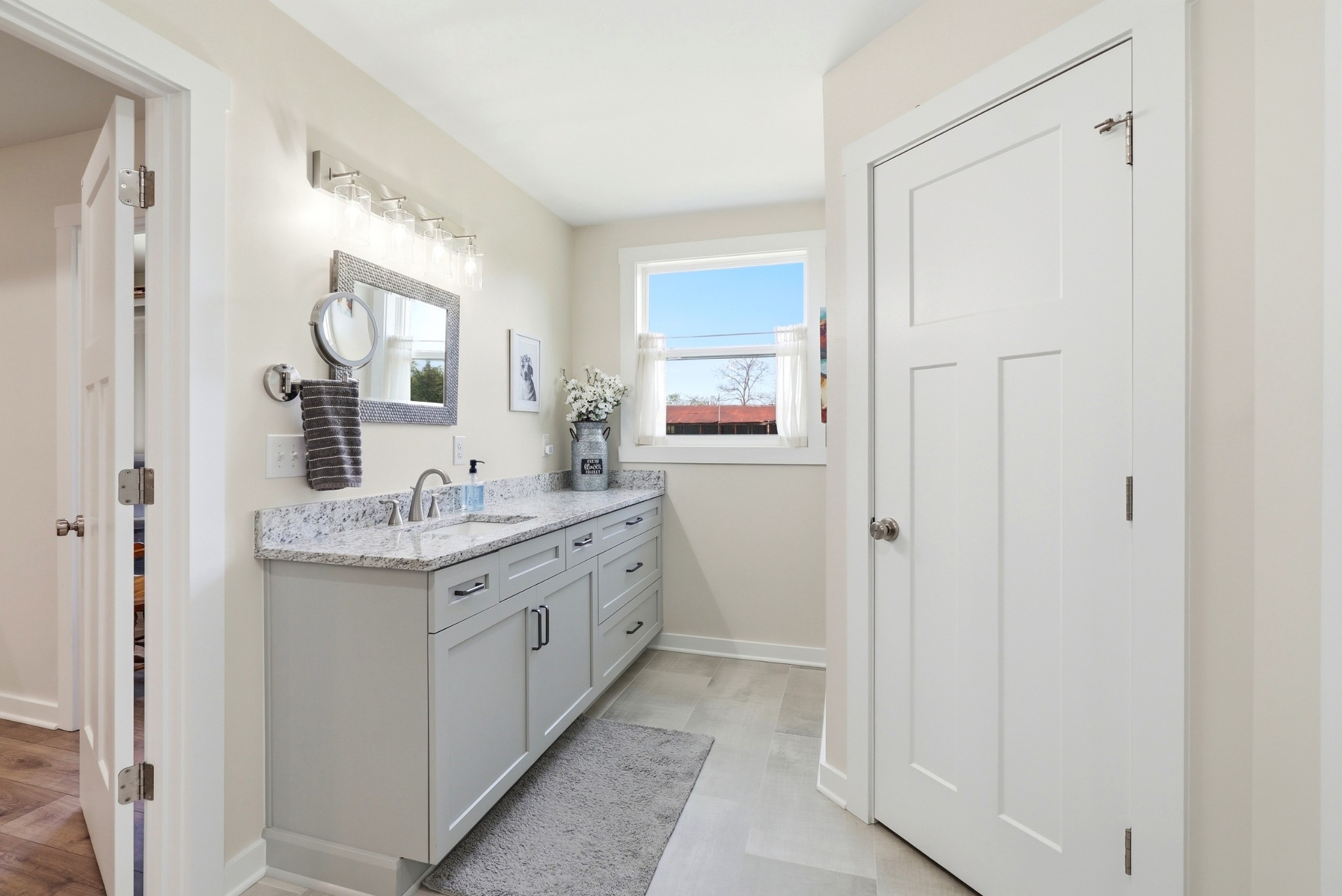 600 Squire Hall Road Shelbyville, TN 37160 - Photo 36 of 69 a bathroom with a granite countertop sink and a mirror