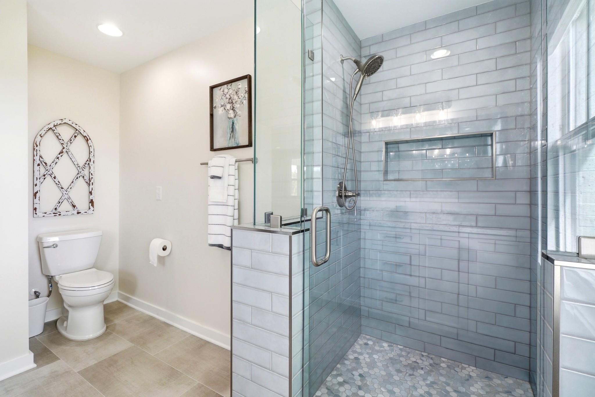 600 Squire Hall Road Shelbyville, TN 37160 - Photo 37 of 69 a bathroom with a toilet sink and shower