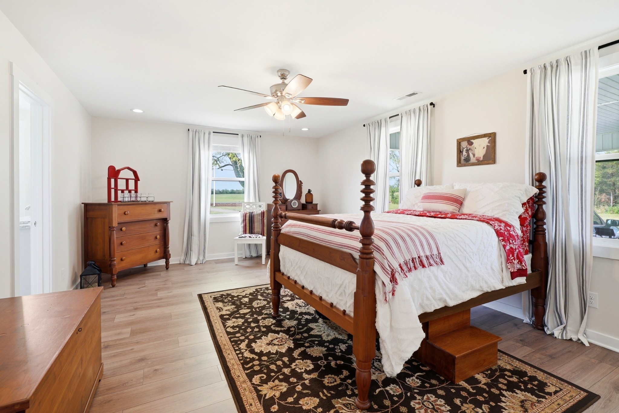 600 Squire Hall Road Shelbyville, TN 37160 - Photo 39 of 69 a bed room with a bed and a chandelier