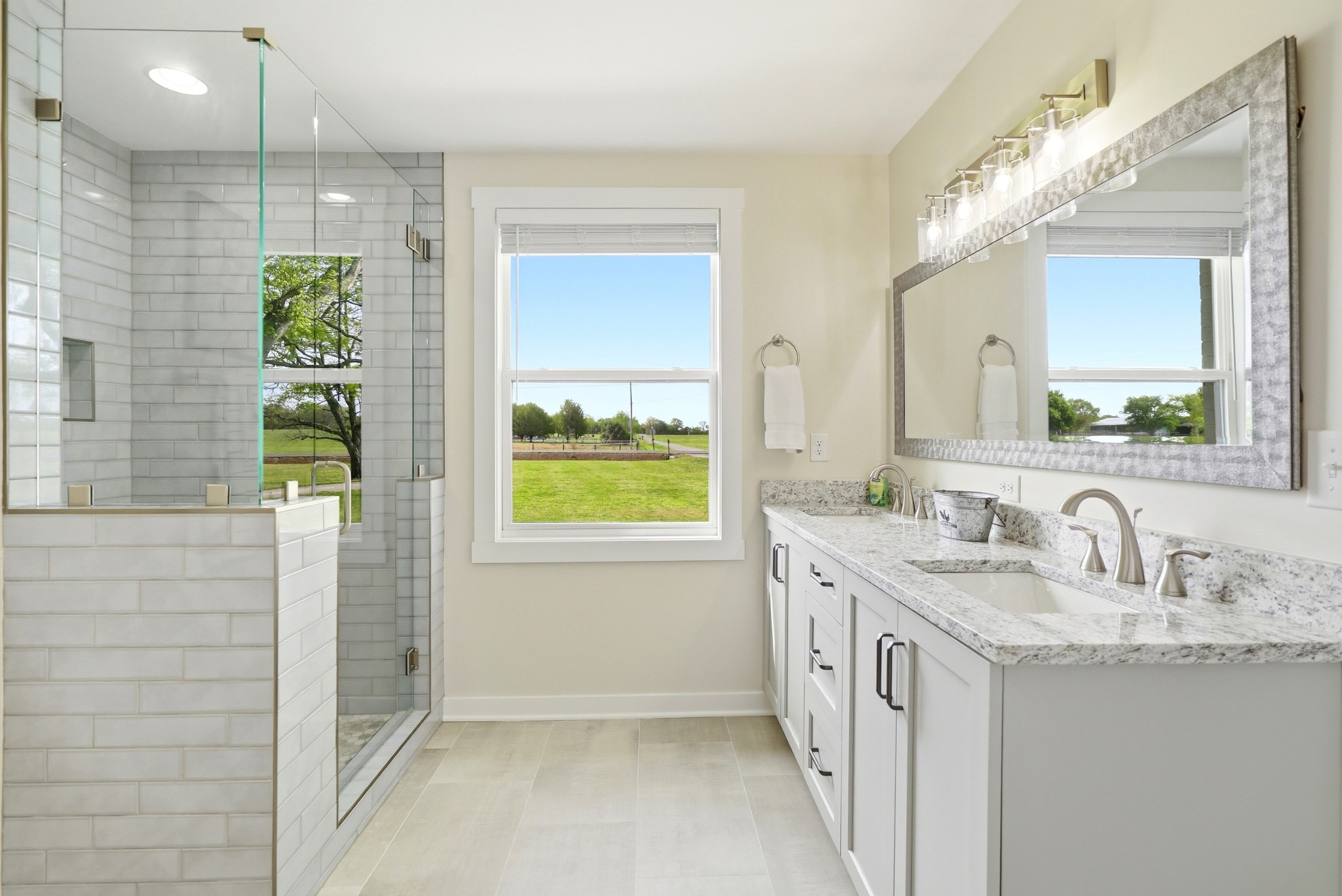 600 Squire Hall Road Shelbyville, TN 37160 - Photo 41 of 69 a bathroom with a granite countertop sink a toilet a mirror and window