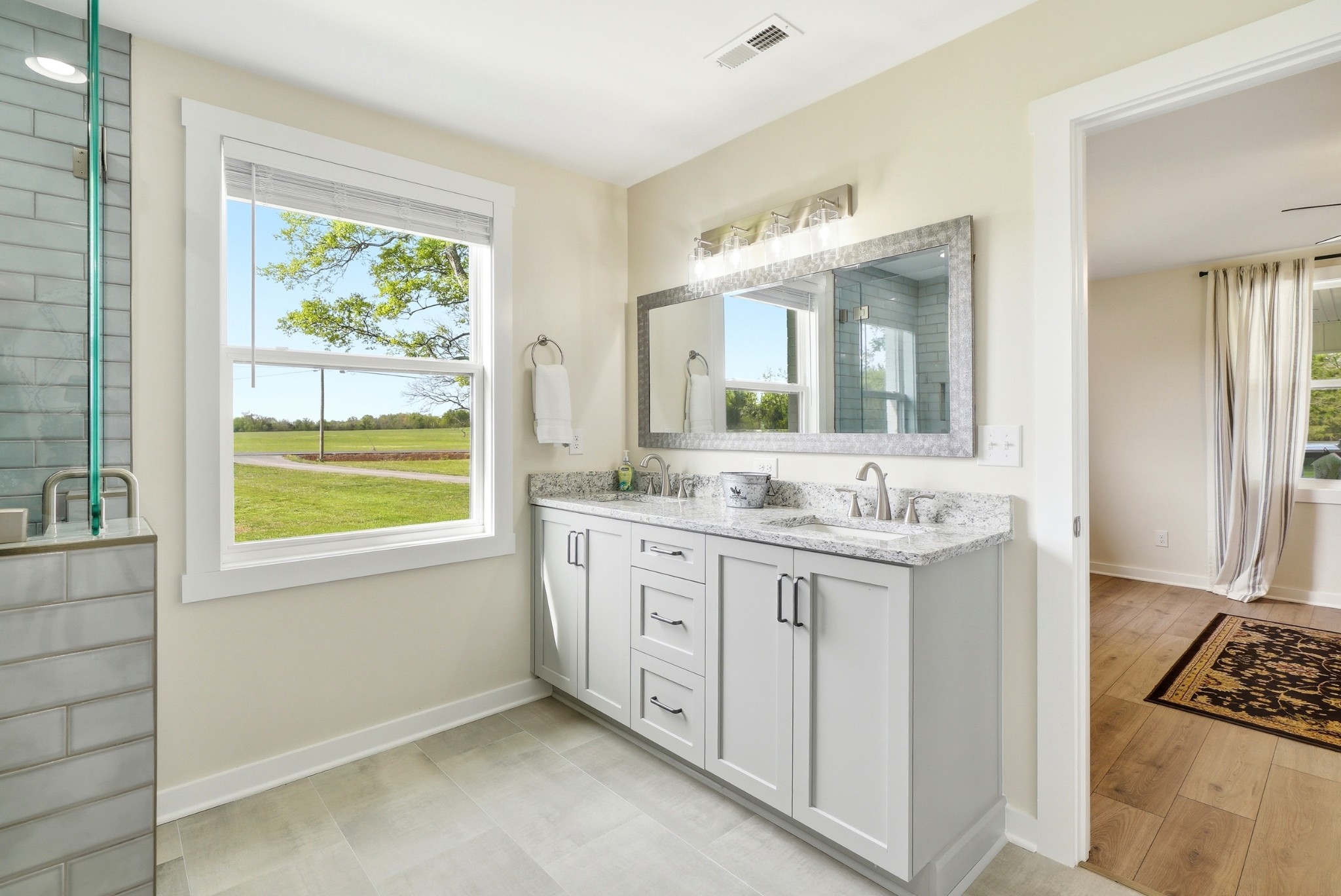 600 Squire Hall Road Shelbyville, TN 37160 - Photo 42 of 69 a bathroom with a granite countertop sink and a large mirror