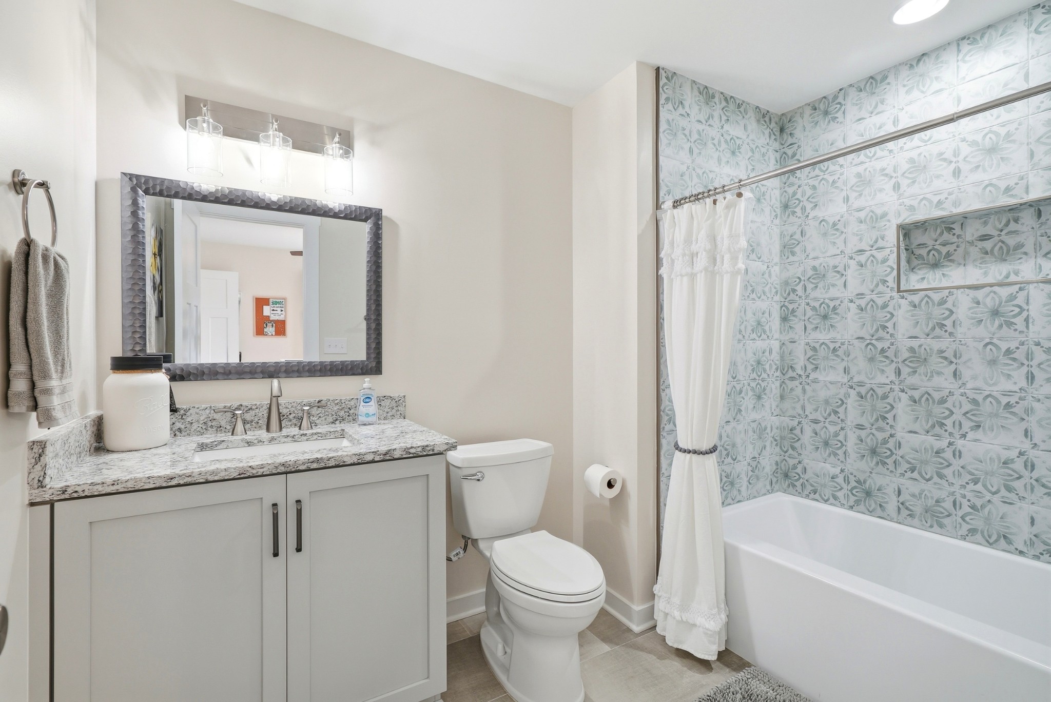 600 Squire Hall Road Shelbyville, TN 37160 - Photo 47 of 69 a bathroom with a granite countertop sink toilet and shower