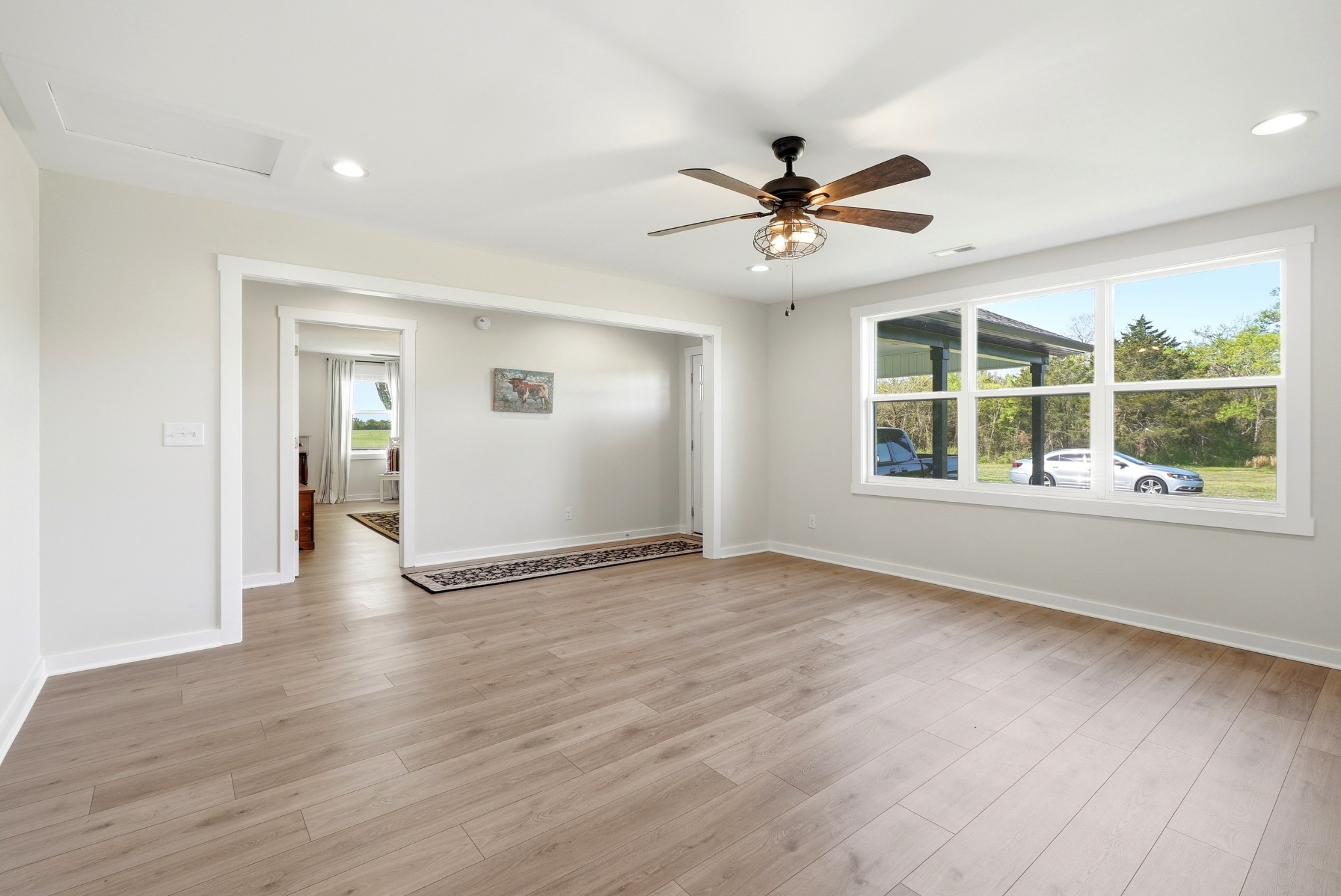 600 Squire Hall Road Shelbyville, TN 37160 - Photo 49 of 69 a view of an empty room with a window and wooden floor