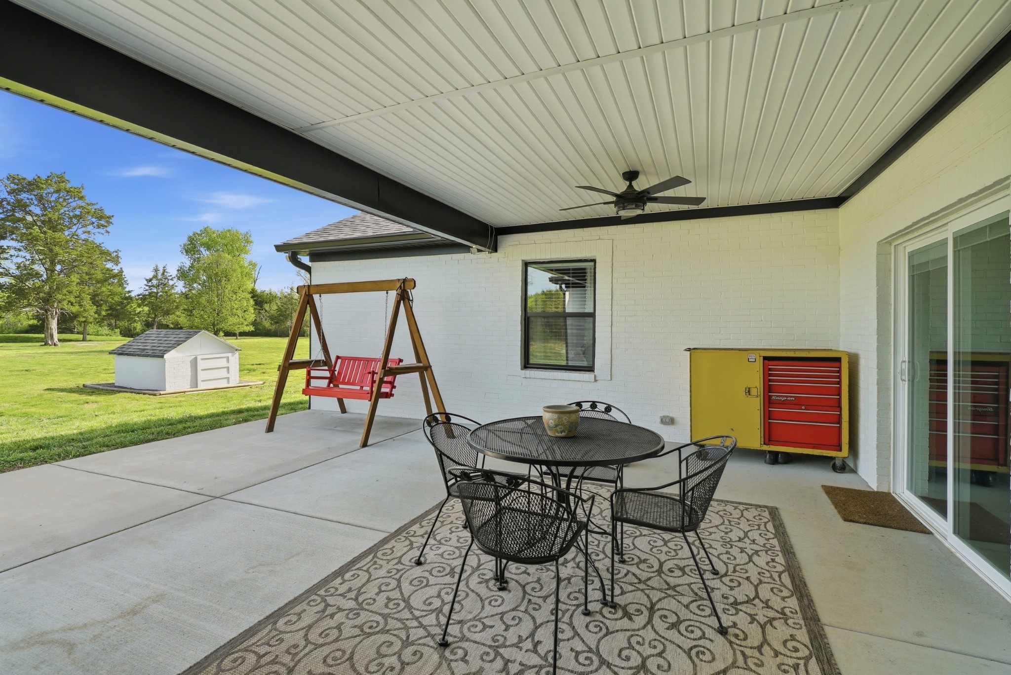 600 Squire Hall Road Shelbyville, TN 37160 - Photo 53 of 69 a patio with a table and chairs and a barbeque