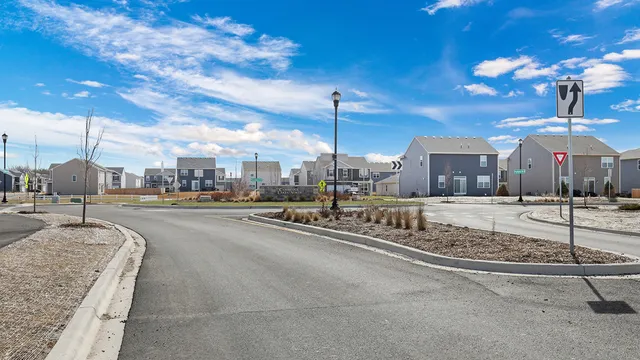 a view of a street with a building in the background