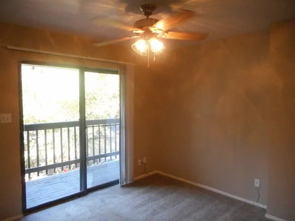a view of empty room with windows