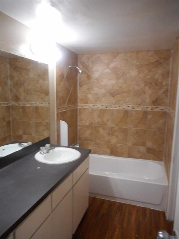 3104 Cedar Street, Unit 4 Austin, TX 78705 - Photo 4 of 18 a bathroom with a sink a toilet and shower