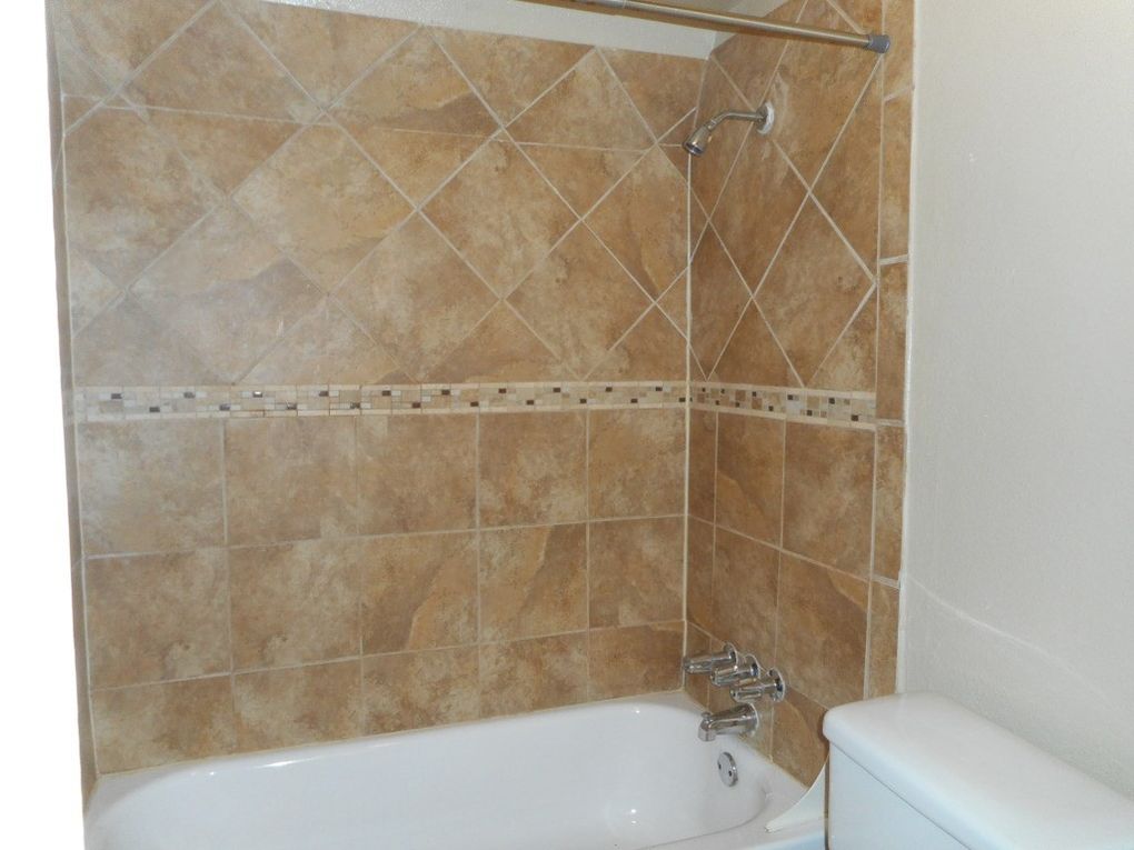 3104 Cedar Street, Unit 4 Austin, TX 78705 - Photo 5 of 18 a bathroom with a bathtub