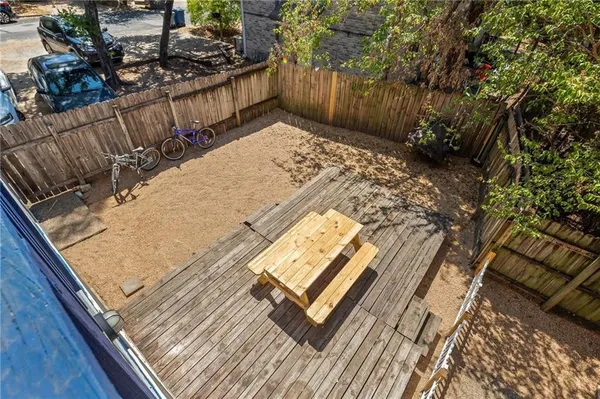 a view of a balcony with wooden floor