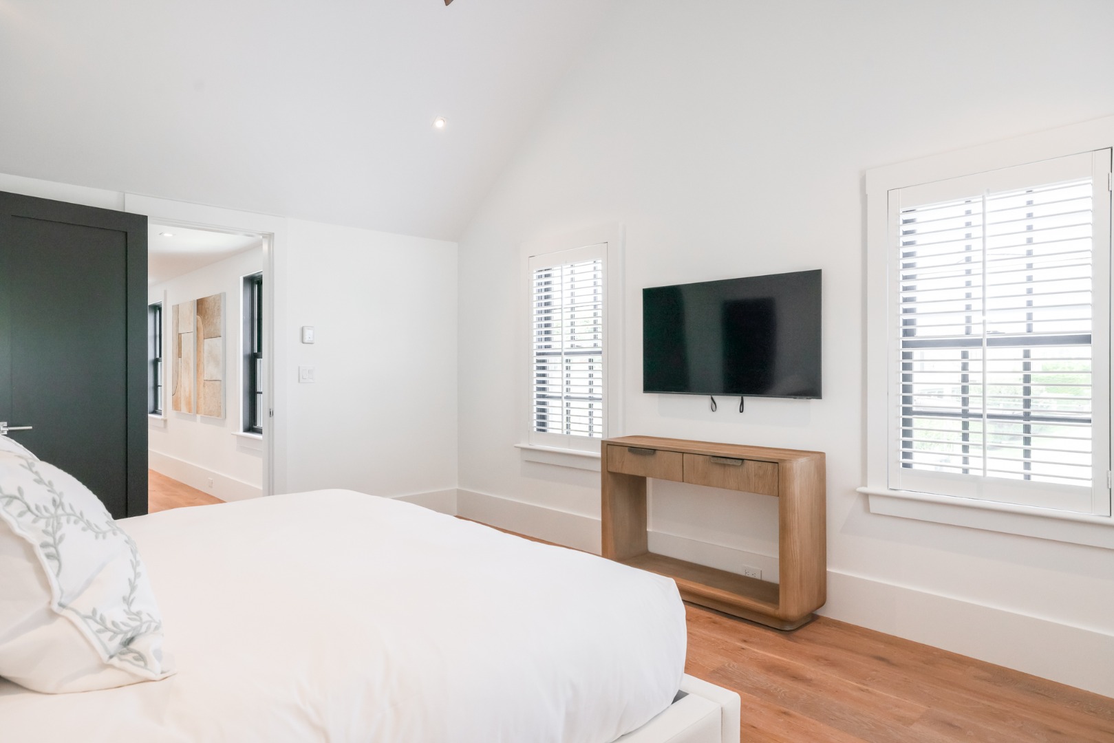 12 Derrymore Road Nantucket, MA 02554 - Photo 28 of 35 a bedroom with a flat screen tv and a bed