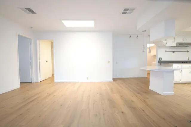 a bathroom with a sink a toilet and window