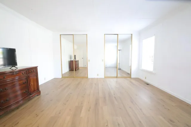 a bathroom with a bathtub and a window