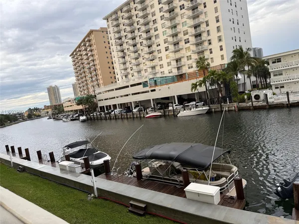 a view of a lake with tall buildings