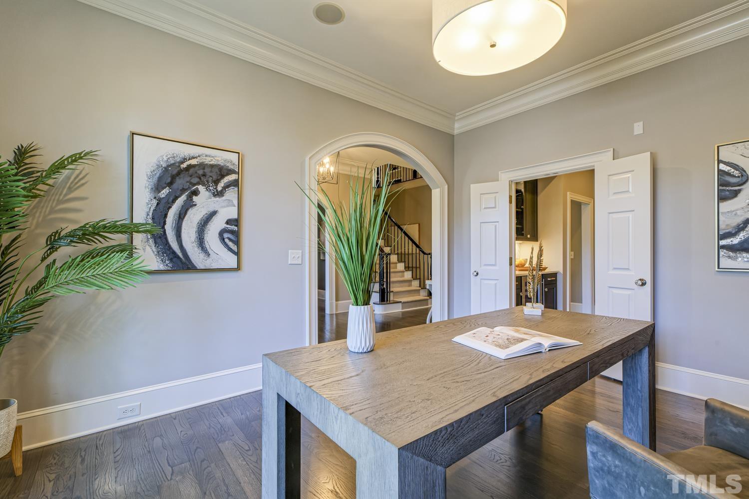 2642 Churchill Road Raleigh, NC 27608 - Photo 12 of 98 a view of a dining area with furniture and a potted plant