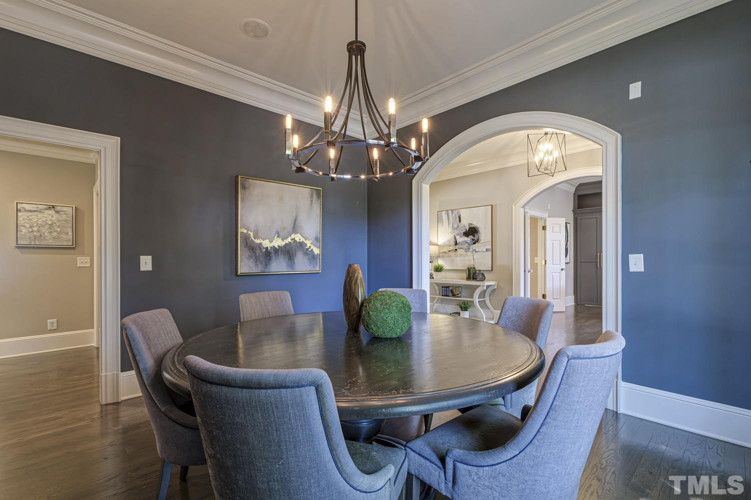 2642 Churchill Road Raleigh, NC 27608 - Photo 15 of 98 a view of a dining room with furniture and wooden floor