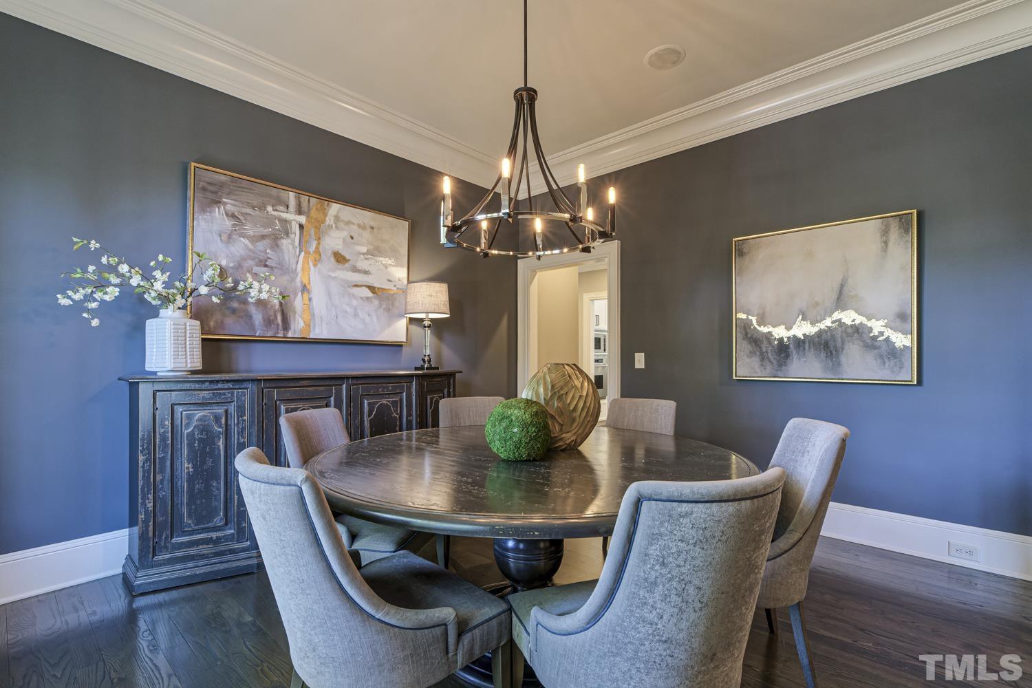 2642 Churchill Road Raleigh, NC 27608 - Photo 16 of 98 a dining room with furniture potted plants and wooden floor