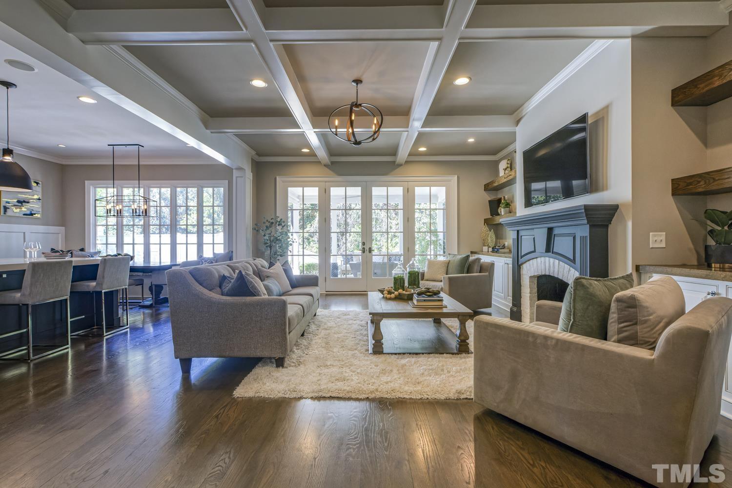 2642 Churchill Road Raleigh, NC 27608 - Photo 18 of 98 a living room with fireplace furniture and a wooden floor