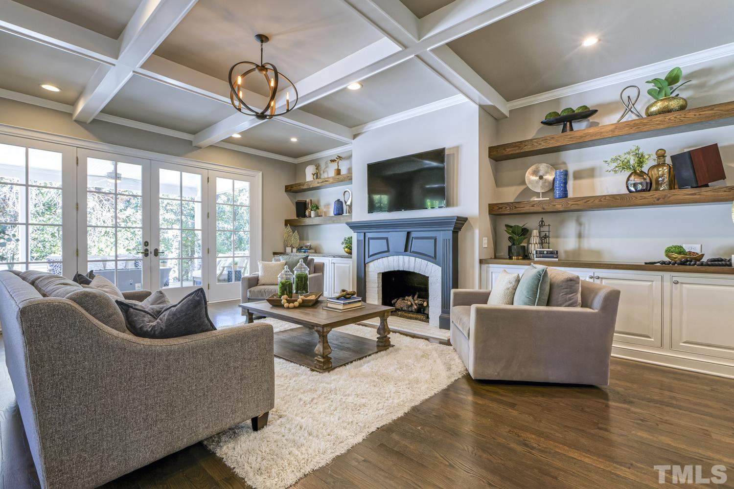 2642 Churchill Road Raleigh, NC 27608 - Photo 19 of 98 a living room with furniture and a fireplace