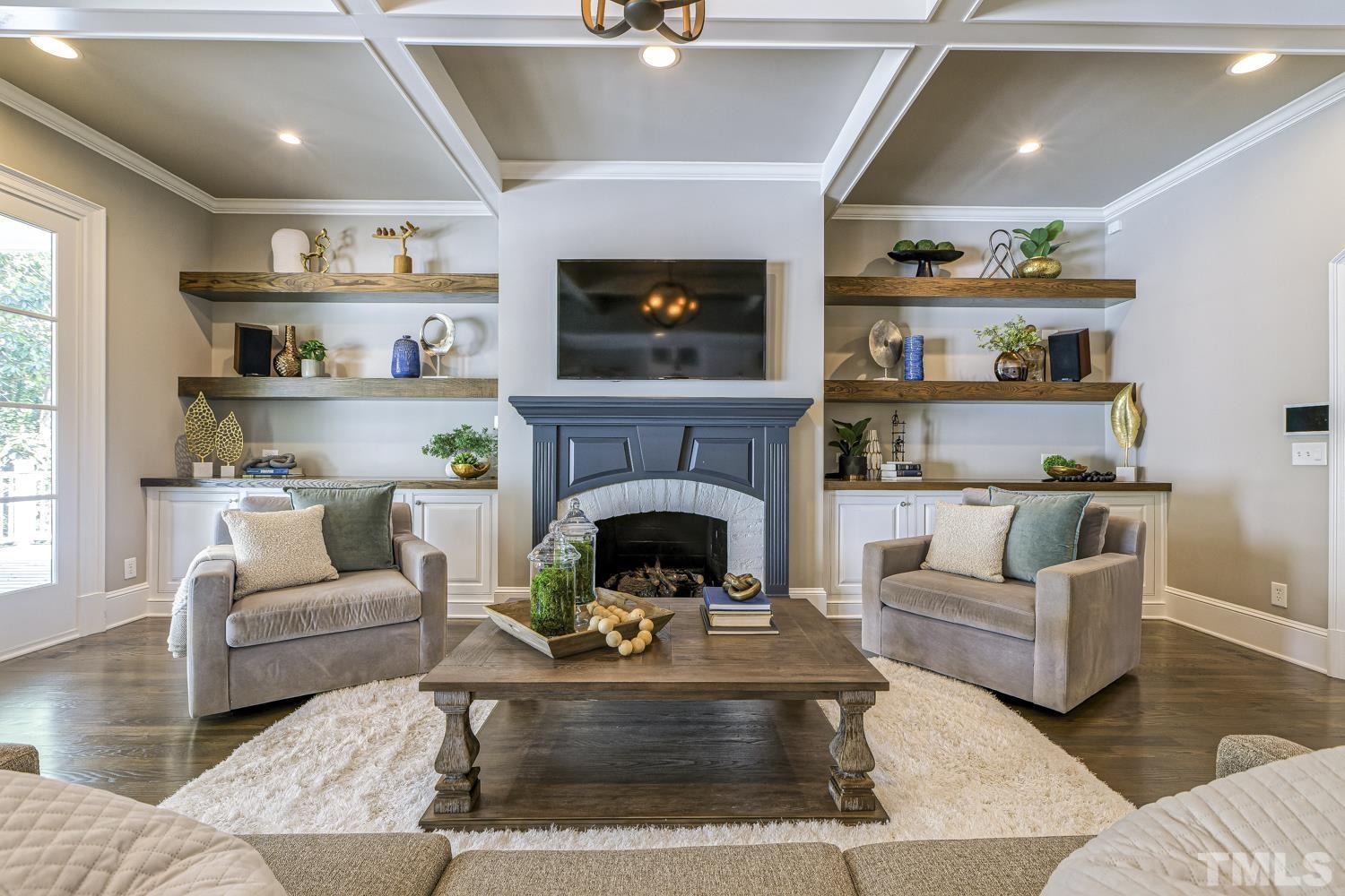 2642 Churchill Road Raleigh, NC 27608 - Photo 20 of 98 a living room with furniture and a fireplace