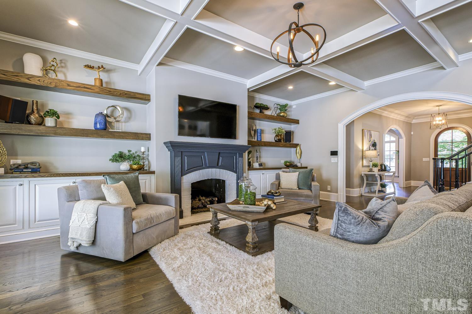 2642 Churchill Road Raleigh, NC 27608 - Photo 22 of 98 a living room with furniture fireplace and flat screen tv