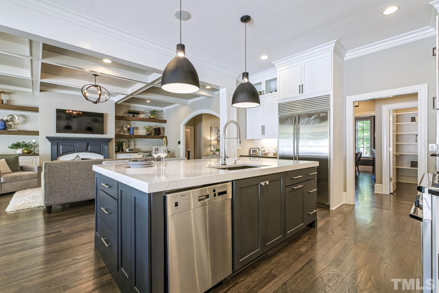 2642 Churchill Road Raleigh, NC 27608 - Photo 28 of 98 a kitchen with stainless steel appliances granite countertop a sink a stove and a wooden floors