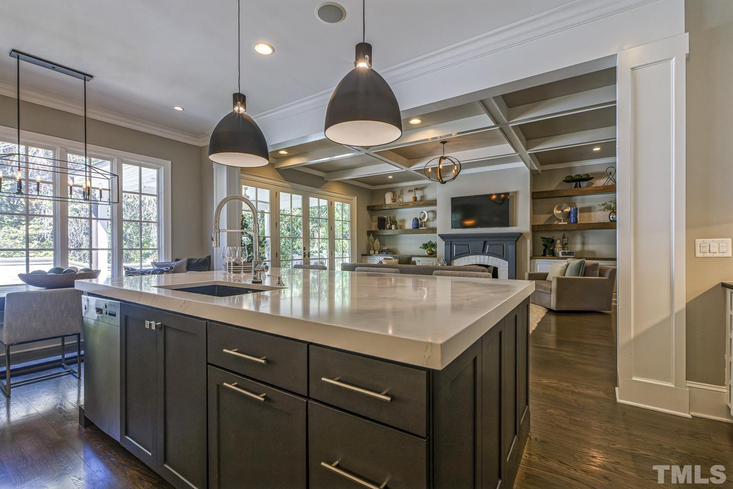 2642 Churchill Road Raleigh, NC 27608 - Photo 34 of 98 a kitchen with stainless steel appliances granite countertop a sink a oven and a large window