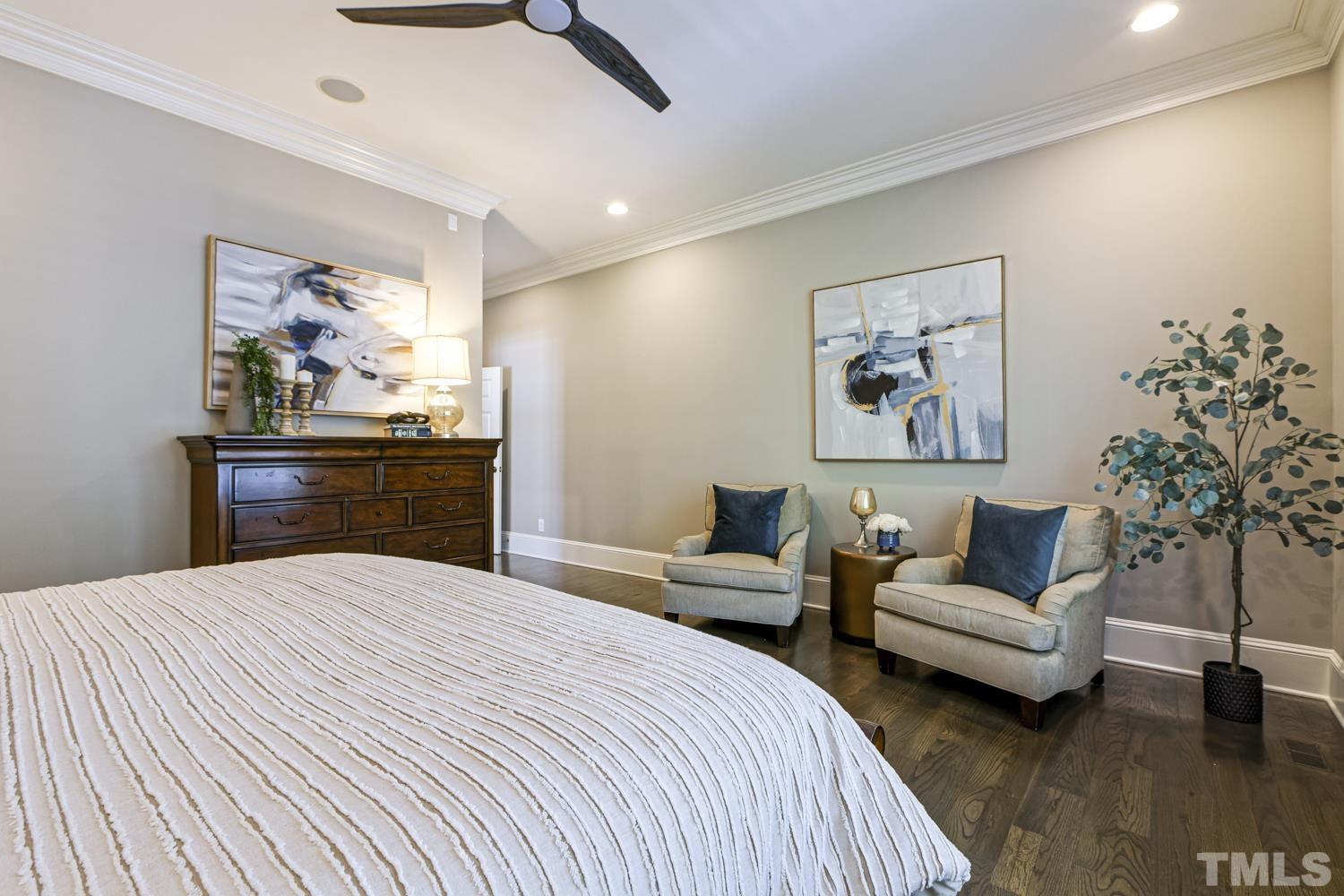 2642 Churchill Road Raleigh, NC 27608 - Photo 42 of 98 a bedroom with a large bed and a couch